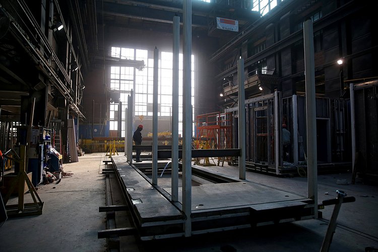 The elevator shaft, stairwell shaft, and stairwell landings are all located within one module per floor.