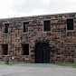 NYC - Governors Island: Castile Williams | Castle Williams, located on the northwest point of Governors Island, was designed and erected between 1807 and 1811 under the direction of Lieutenant Colonel (later Colonel) Jonathan Williams, Chief Engineer of the Corps of Engineers and first Superintendent of the United States Military Academy at West Point. The nearly circular fort, measuring 210 feet in diameter with 40-foot high and 7 to 8 feet thick red sandstone walls, established a prototype for American coastal fortification design for the rest of the 19th century with its multiple levels of enclosed or fortified gun enplacements (casemates)...During the Civil War, the casemates of Castle Williams alternatively housed newly recruited Union troops, served as a barracks for the garrison's troops, and imprisoned Confederate enlisted men and deserters from the Union Army.  Following the war, it became a low-security military prison until the Coast Guard arrived in 1966 and converted it into a community center.