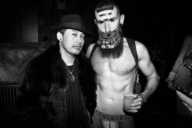 Hair stylist Lorenzo Diaz and 25-year-old Stephen Miles (and his 7-year-old beard) take a breather.