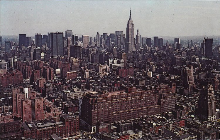 Looking northeast the large low profile art deco building occupying the entire block between Eighth and Ninth Avenues and 15th and 16th Streets