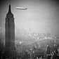 The Hindenburg flies past the Empire State Building over Manhattan on August 8, 1936, en-route to Lakehurst, New Jersey, from Germany.