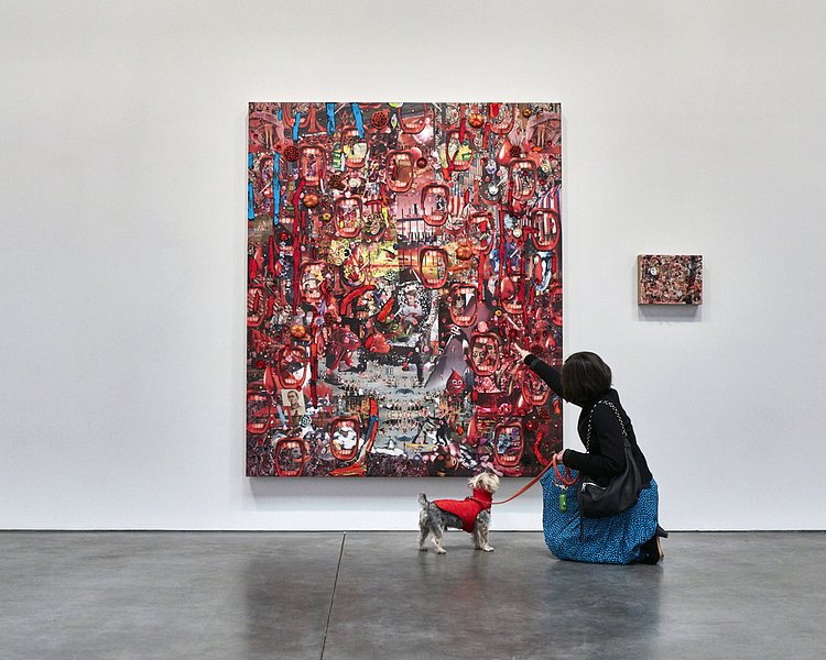 The color red is not visible to a dog's eyes, however this didn't stop Rocky from an interest in the surface and textures of this Elliott Hundley painting on view at Andrea Rosen Gallery.
