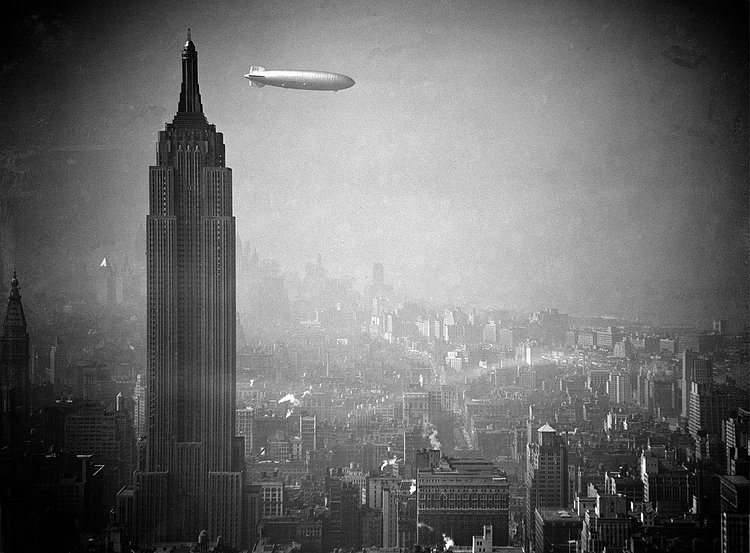 The Hindenburg flies past the Empire State Building over Manhattan on August 8, 1936, en-route to Lakehurst, New Jersey, from Germany.