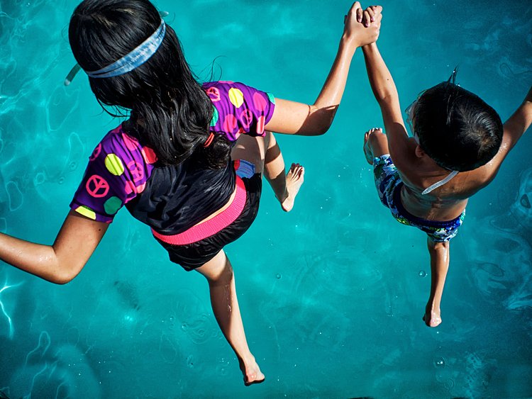 Kids leap into the water