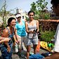 On a recent Sunday, residents gathered for a garden work day on the roof of Umbrella House, where they tended to plants and tidied up.