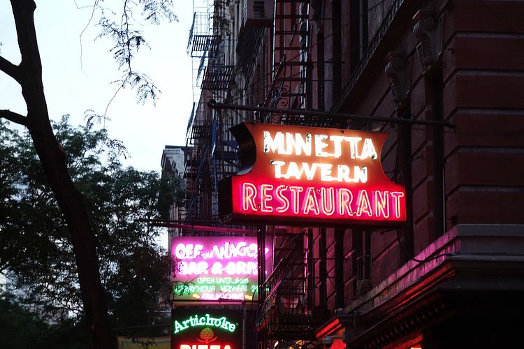Neon signs on MacDougal Street