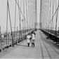 Pedestrians on the upper deck promenade of Brooklyn Bridge