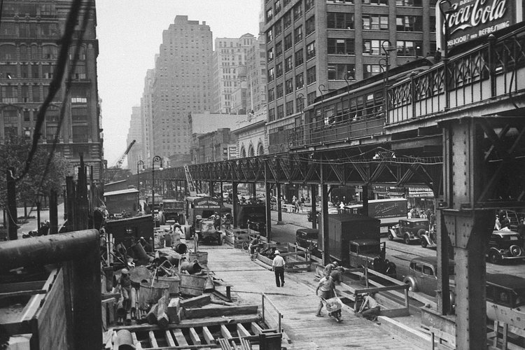 Work begins for an underground replacement for the Sixth Avenue "El" (elevated train), shown looking north from 42nd Street, July 28, 1936. The El is to be demolished in 1939.