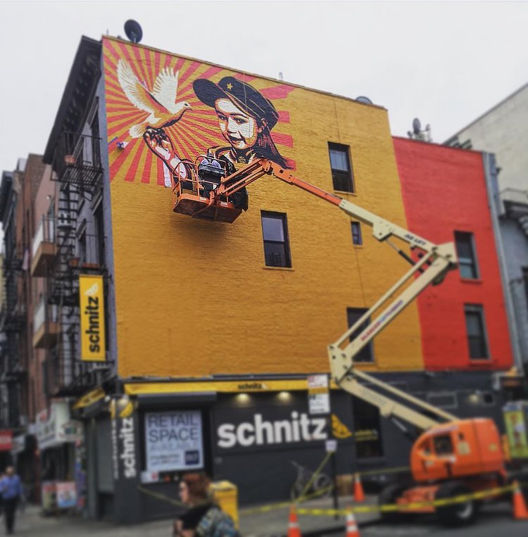 Shepard Fairey at work this evening on 11th Street at 1st Avenue #eastvillage #mural #streetart #shepardfairey #lisaproject #obeygiant #publicart In collaboration with @thelisaprojectnyc