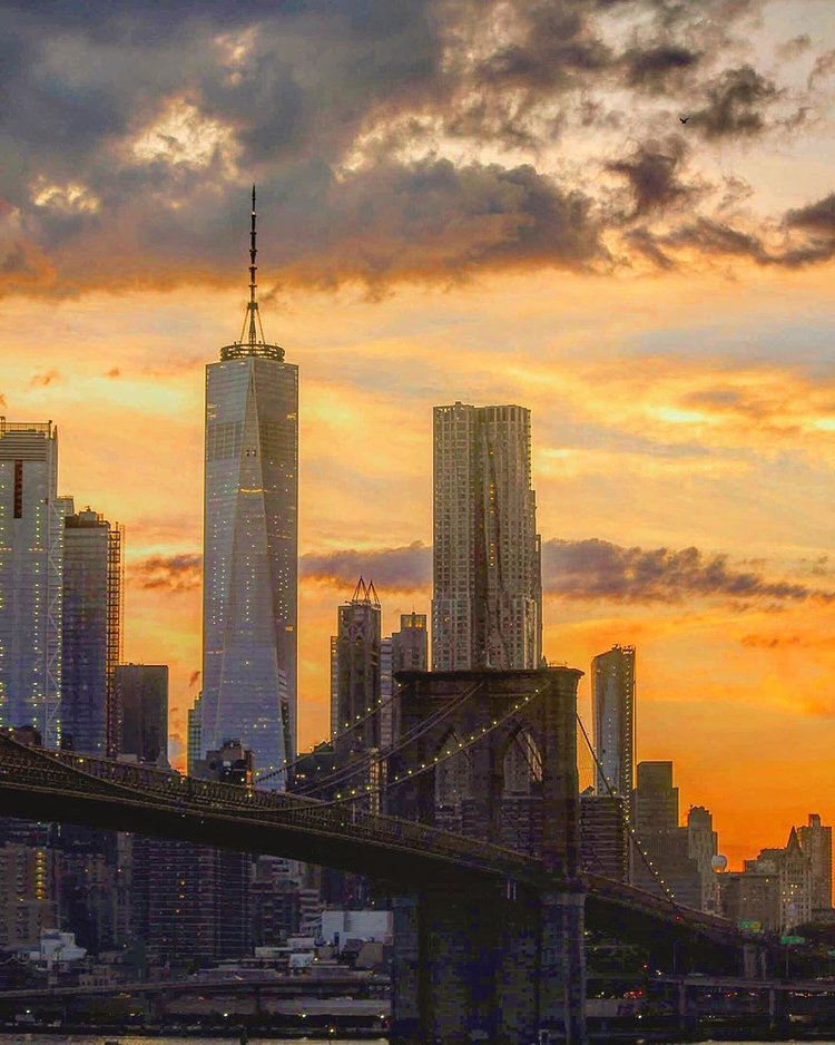 Sunset over Lower Manhattan and Brooklyn Bridge