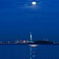 Time-lapse of The Full Moon Setting over the Statue of Liberty into Sunrise NYC