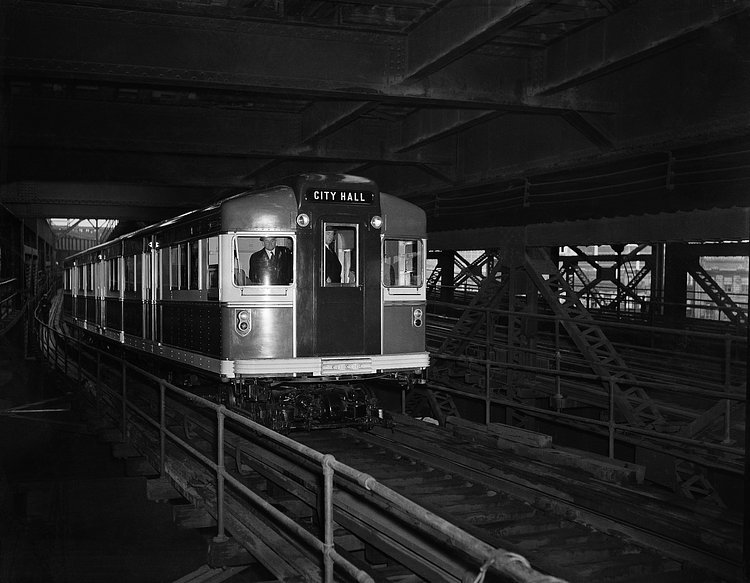 The new streamlined red, white and blue Rapid Transit car which made its "maiden voyage" along the BMT lines in New York, March 28, 1939. It weighs 76,000 pounds, about half the weight of the conventional cars, and is equipped with special sound-deadening and shock-cushioning devices.