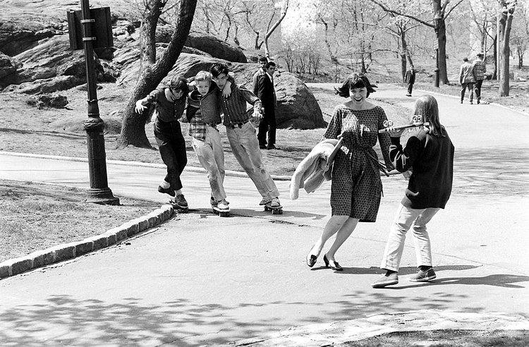 A group of kids practice a new trick called the three-headed monster. Onlookers flee in terror.