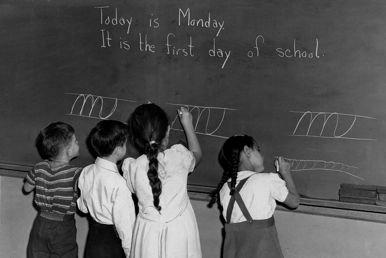 1940s — September 1943: First-grade pupils at the blackboard