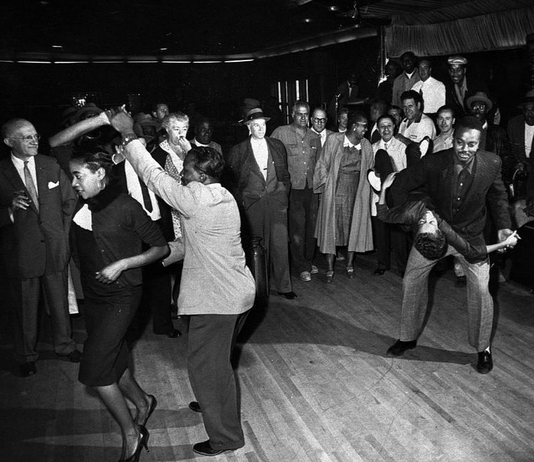 People dance a final impromptu jitterbug session at the Savoy Ballroom in the Harlem section of New York before the close of the landmark dance hall on Oct. 3, 1958.