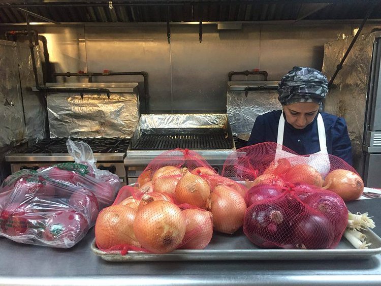 Chef Nida Al Janabi preps in the kitchen.