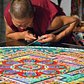 Tibetan monk adding sand to a mandala