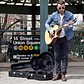 Chris Leamy busks to help the homeless
