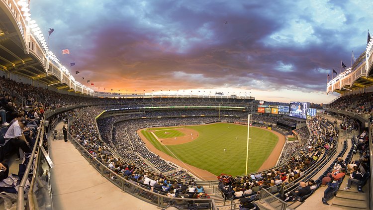 Yankee Stadium | An amazing sunset at Yankee Stadium while watching the Yankees play the Rangers.  Notice the plane in the shot, climbing out of takeoff from LaGuardia.