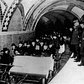 This group of financiers and city officials get a tour of New York City's first subway in January 1904 while the city's policemen stood by on the platform at City Hall Station. Seated toward the front of the ceremonial flat car are Alexander Orr, August Belmont, John B. McDonald, and Mayor George B. McClellen.