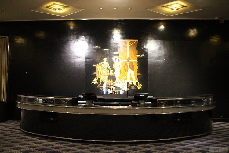 Lower Level Bar | Built in 1932, Radio City Music Hall is a prime example of art deco architectural style that has withstood the test of time. With tons of gold, reflective surfaces and geometric design, walking through the venue is a bit like stepping back in time. Most of the fixtures, furniture and ornamentation are original, and any replacements are exact replicas of how the theater looked 80 years ago.

Read more here: <a href="https://viewing.nyc/i-braved-a-walkthrough-of-radio-city-music-hall-meant-for-tourists/" rel="nofollow">viewing.nyc/i-braved-a-walkthrough-of-radio-city-music-ha...</a>