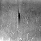 Fog eclipses nearly all of midtown Manhattan except for the 103-story Empire State Building, seen in this 1961 aerial photo. 