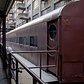 The EDC placed this train here to commemorate the building's history as a train depot. It is a Long Island Rail Road car from the 1950s.