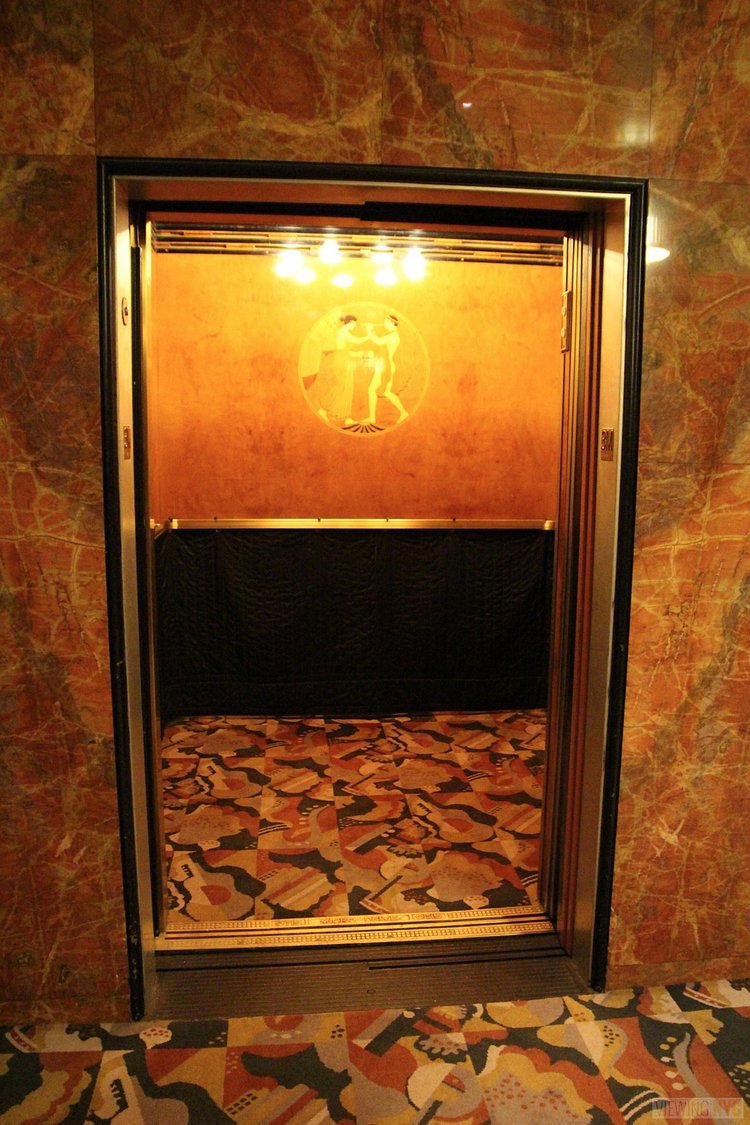 Elevator | Built in 1932, Radio City Music Hall is a prime example of art deco architectural style that has withstood the test of time. With tons of gold, reflective surfaces and geometric design, walking through the venue is a bit like stepping back in time. Most of the fixtures, furniture and ornamentation are original, and any replacements are exact replicas of how the theater looked 80 years ago.

Read more here: <a href="https://viewing.nyc/i-braved-a-walkthrough-of-radio-city-music-hall-meant-for-tourists/" rel="nofollow">viewing.nyc/i-braved-a-walkthrough-of-radio-city-music-ha...</a>