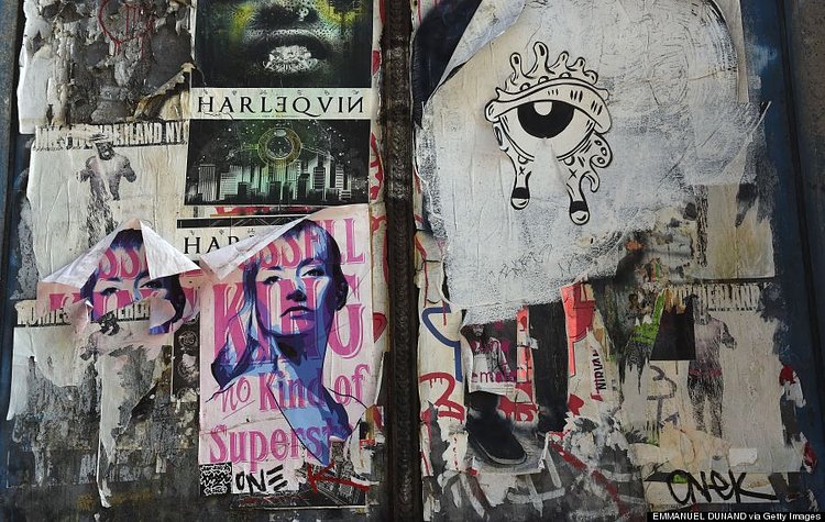 Street graffiti adorn a wall in New York on April 25, 2014