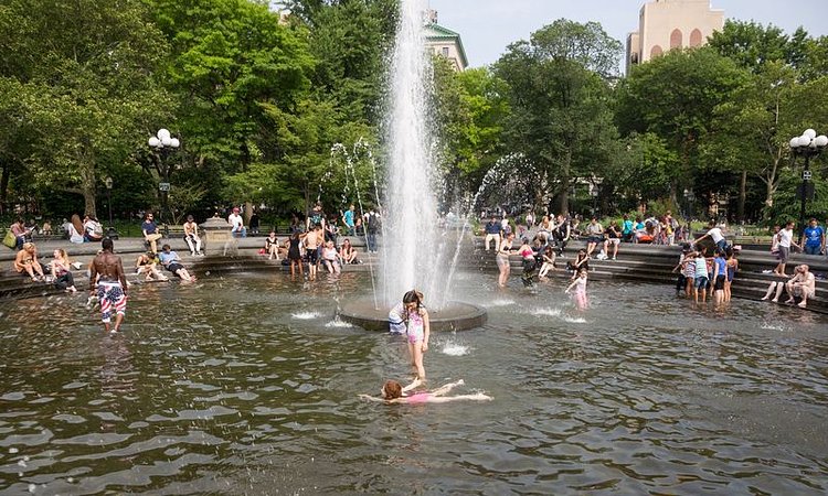 Girls swimming on a hot day in Washington Square Park.
