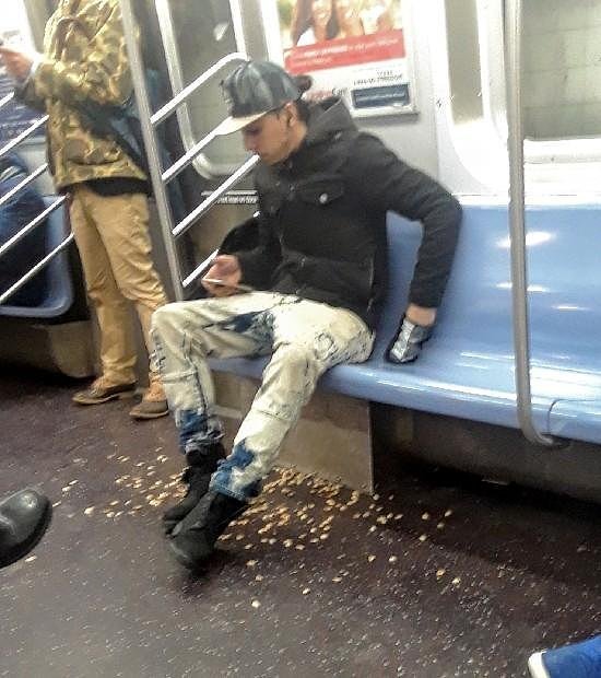 Asshole throwing nuts onto NYC Subway Floor