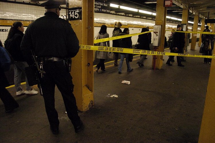 2000's: A 14-year-old boy was reportedly on his way to school when he was stabbed at the subway station at West 145th St. and St. Nicholas Avenue in 2007. Police tape cordons off the scene, pictured here.
