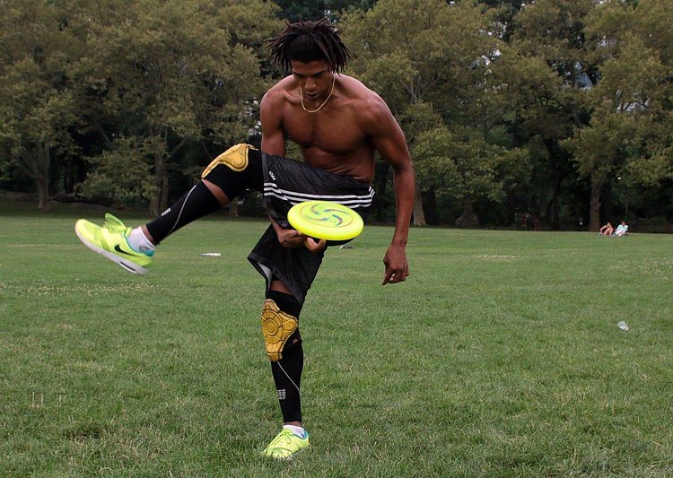 Ivan White, of Woodside, Queens, jams with a frisbee in Central Park's Sheep Meadow on Thursday.