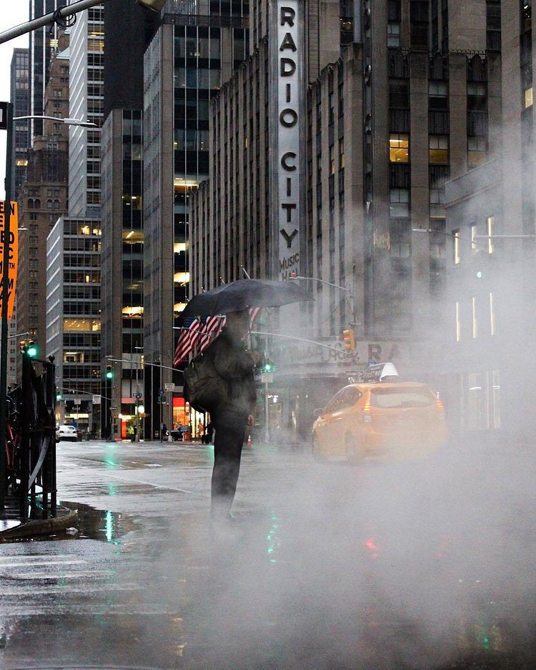 Midtown, Manhattan. Photo via @juliansilvermanphotos #viewingnyc #newyork #newyorkcity #radiocitymusichall #nyc #rain