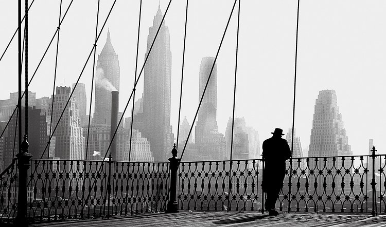 Man gazing off Brooklyn Bridge, 1950