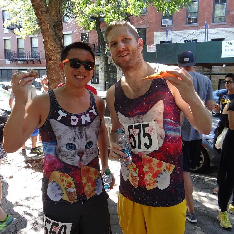 Tickets are on sale for the 2017 NYC Pizza Run! Throwing it back to last year when we asked ourselves "who wore it better?" in this pic. The answer is: "obviously anyone who is wearing a psychedelic tank top featuring a cat eating pizza and tacos is 100% AWESOME in our book." Sign up now and you can look this cool next month