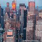 Photograph by George Steinmetz @geosteinmetz / @thephotosociety  Sunset reflects off the H&M building in this view looking east on 42nd St. towards Midtown in New York City.