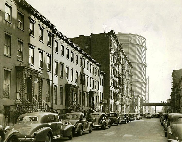 East 20th Street facing east towards 1st Avenue in 1938 with two huge gas holders in the distance.