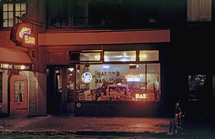 Little neighborhood bar called ‘Harry’s Bar’ lit up at night on 52nd Street around 7th Avenue Mdtown area 1946