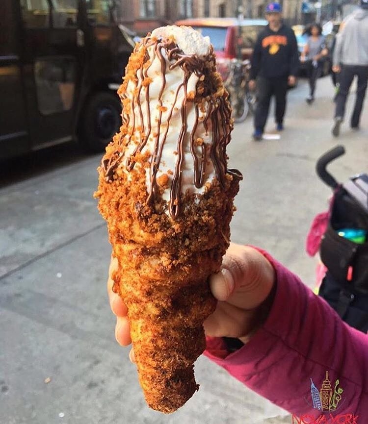 coneCHURRO!® NYC! 1:30pm - midnight, daily.  Lookout for additional MAY FLAVORS!! *Banana Brûlée *Strawberry Shortcake, *Nutella S'mores Galore!!! Pictured: nutty professor.  Photo cred: novayorkavoce
JHERI CURL - sea salt caramel coated inner cone, cinnamon struessel rim with sea salt caramel drizzle.

NUTTY PROFESSOR:  nutella smeared "inner" cone with brown sugar pecan rim, world's tastiest tahitian vanilla bean soft serve with toasted almonds, nutella drizzle and frosted pecan top.

TWINKLE SPRINKLES:  66% Valrhona caribe chocolate ganache coated inner cone with happy dance rainbow sprinkles.

POINDEXTER:  66% Valrhona caribe chocolate ganache coated inner cone with happy dance rainbow sprinkled RIM.

CHOCO-RASPBERRY SUNDAE:  chocolate ganache/raspberry jam filling, chocolate struessel rim, raspberry and chocolate sauce drizzle. 
GREEN ENVY:  red bean inner cone, green tea struessel rim, green tea/vanilla swirl, red bean top. 
204 E. 10th st. @2nd Ave., NYC, BITCHESSSZz.  conechurro.com