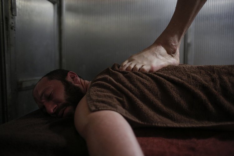 Joel Reuben Ganz receives a massage, a gift from his friend Michael Ngo, for his 39th birthday.