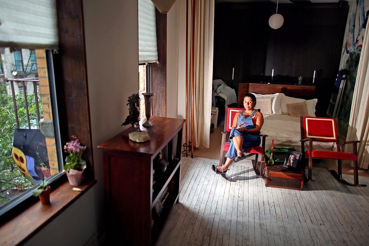 Nanda Arias was among those who volunteered during a recent work day for the building’s roof garden.