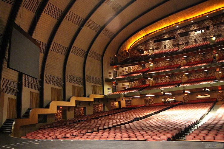 Center Stage, Looking Left | Built in 1932, Radio City Music Hall is a prime example of art deco architectural style that has withstood the test of time. With tons of gold, reflective surfaces and geometric design, walking through the venue is a bit like stepping back in time. Most of the fixtures, furniture and ornamentation are original, and any replacements are exact replicas of how the theater looked 80 years ago.

Read more here: <a href="https://viewing.nyc/i-braved-a-walkthrough-of-radio-city-music-hall-meant-for-tourists/" rel="nofollow">viewing.nyc/i-braved-a-walkthrough-of-radio-city-music-ha...</a>